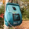 hanging in tree with shower head connected and in pouch